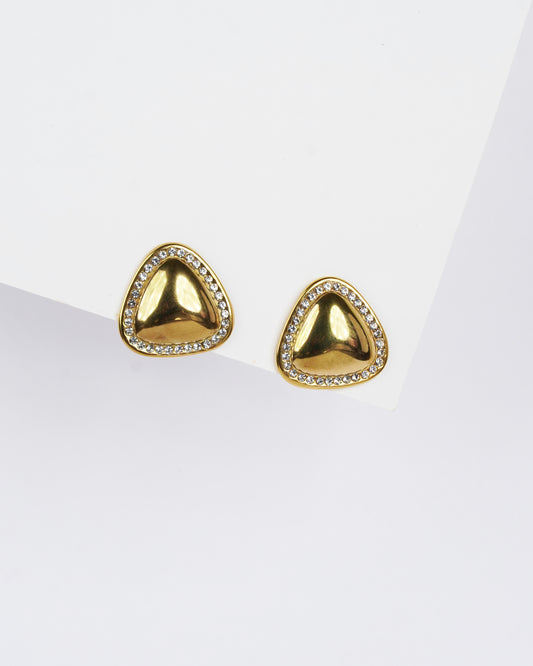 Gold triangle-shaped earrings with clear stones on a white background